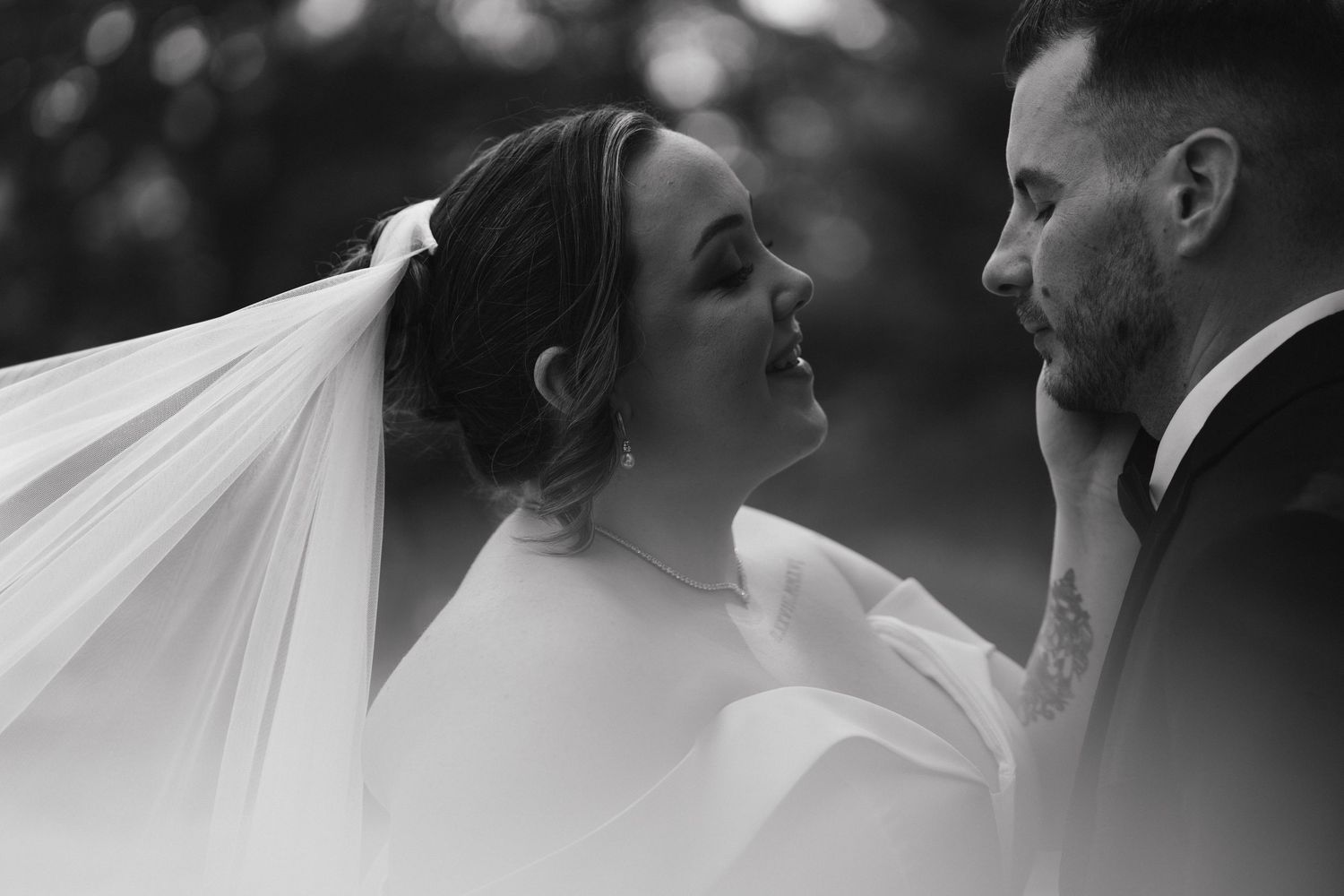 Black and white wedding photography sequence showing tender moments between newlyweds.