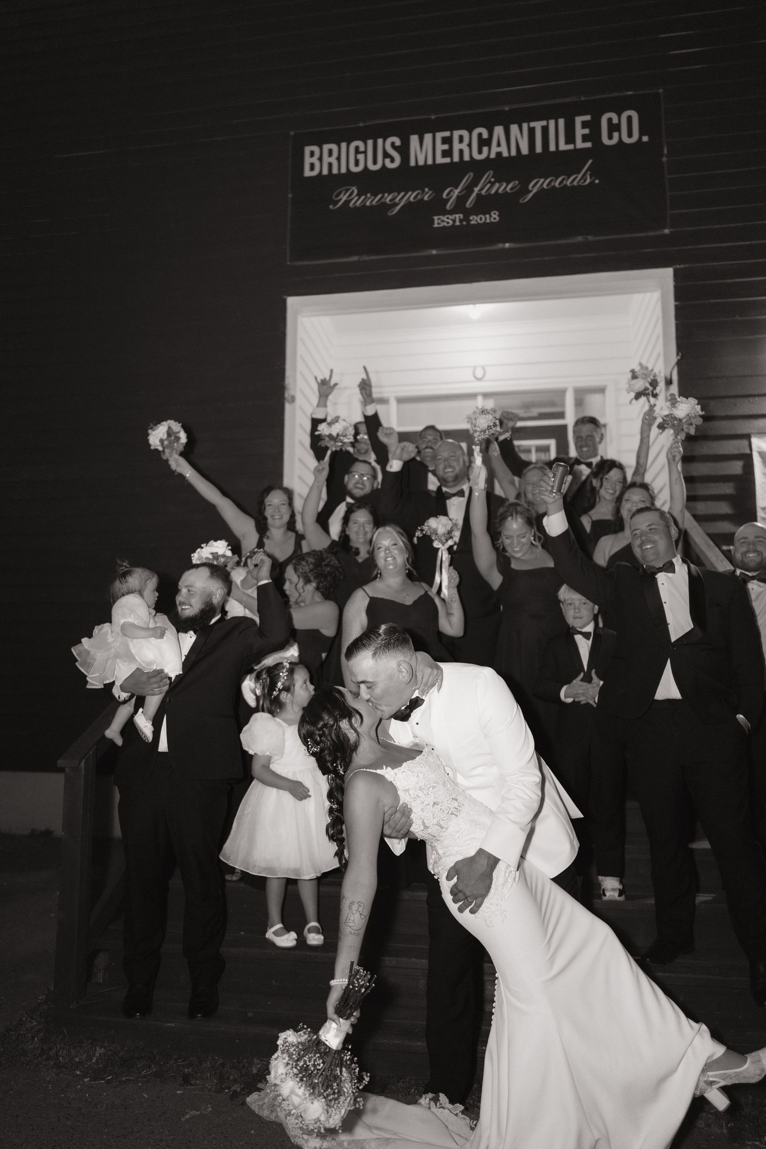A series of wedding reception photos showing couples dancing and dipping in formal attire at Briggs Mercantile Co.