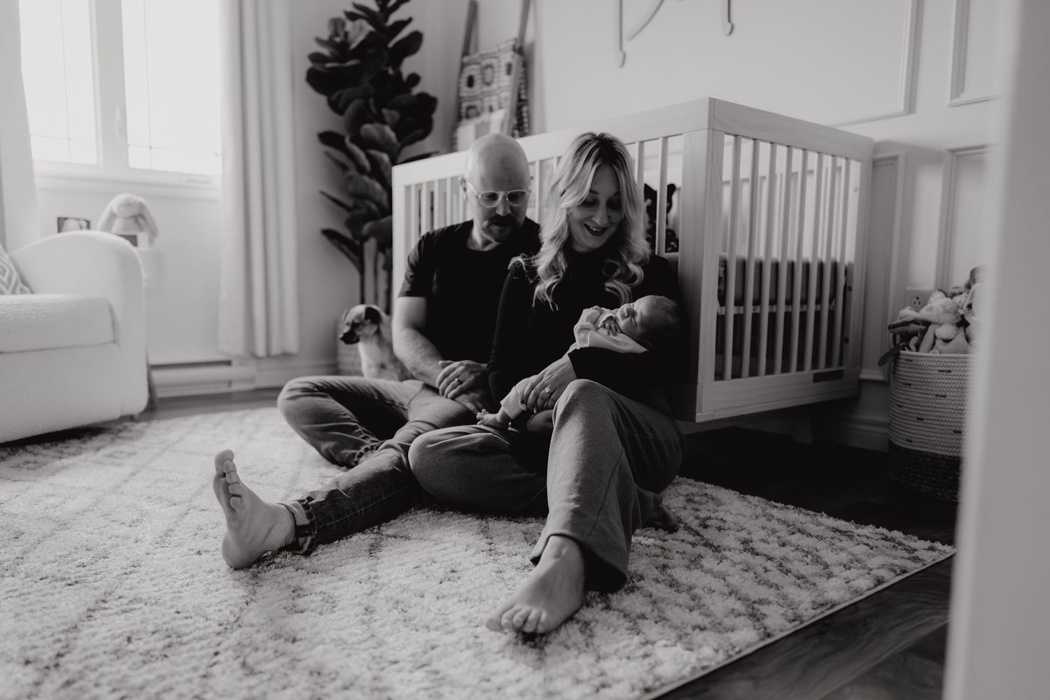 Wide angle view of a bright indoor photography session near white walls and windows.