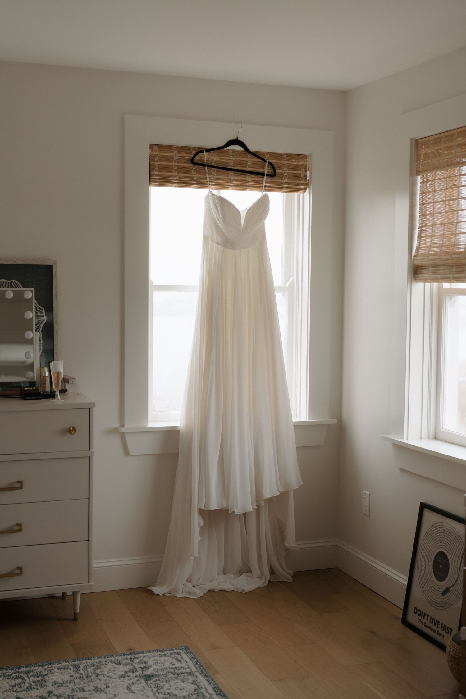 A series of minimalist interior room photos showing white curtains, wooden floors, and natural light through windows.