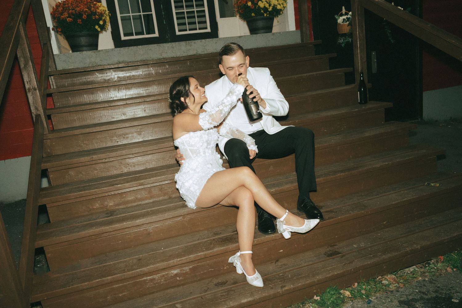 Person in white dress sits on wooden stairs in various poses during a photo session.