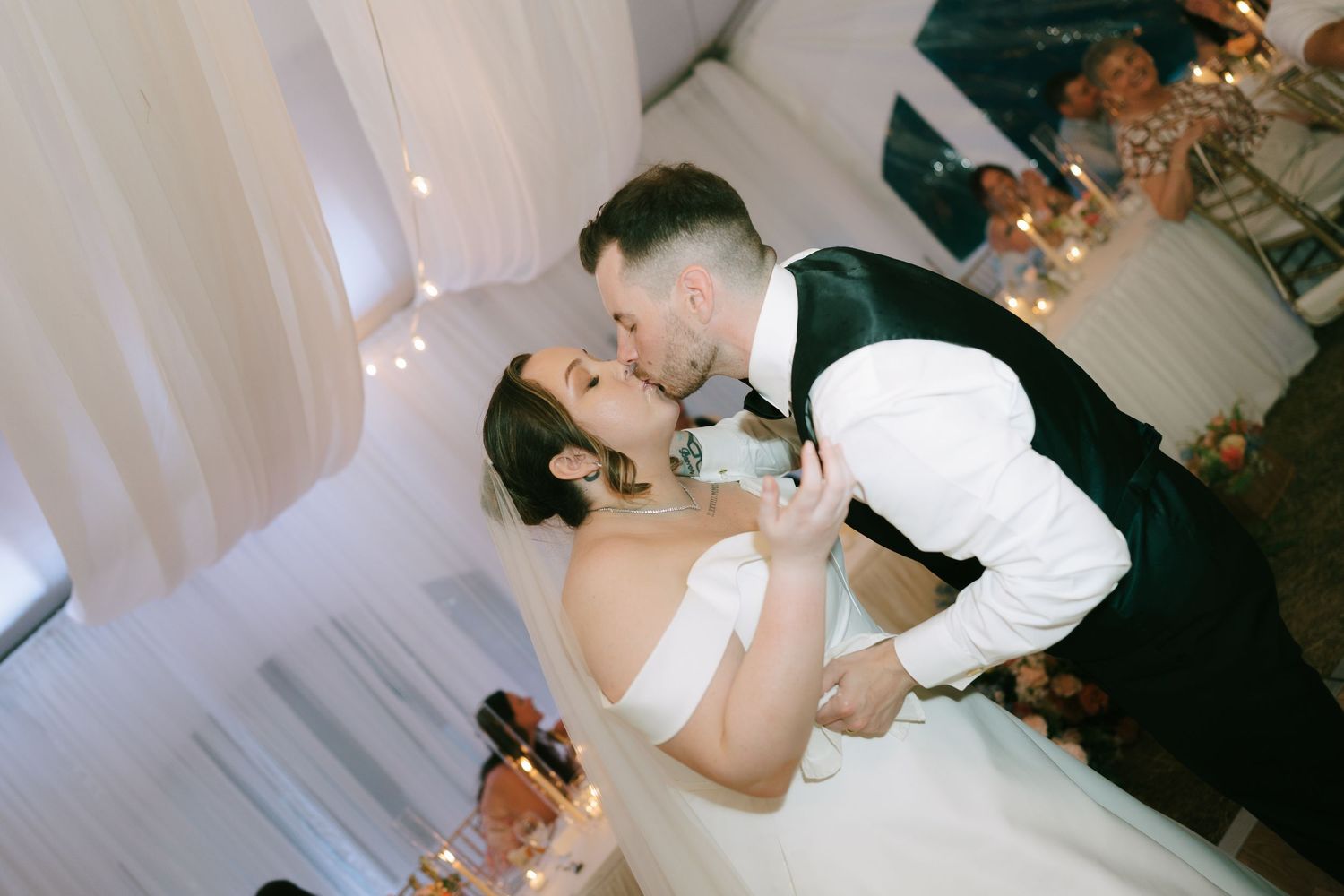 Dancing sequence at wedding reception shows couple's romantic celebration.