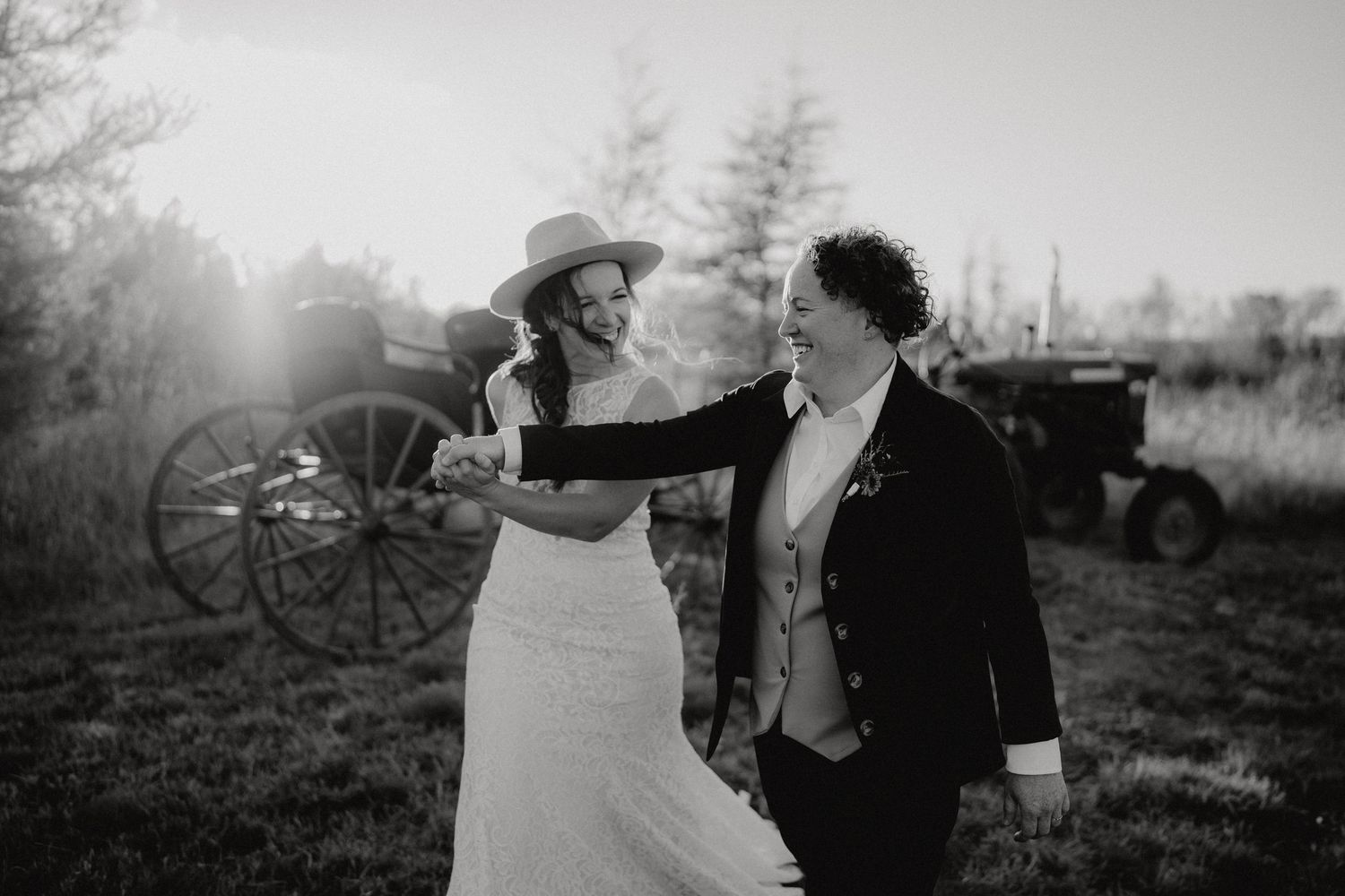 Candid wedding photography in black and white with natural outdoor lighting.
