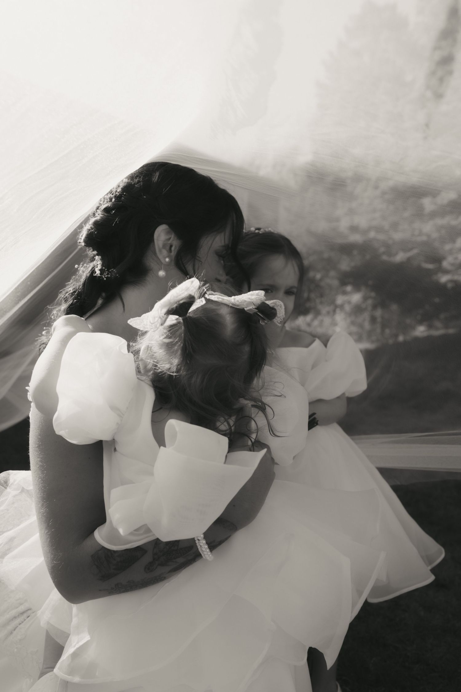 A romantic black and white photo sequence shows a couple in wedding attire sharing intimate moments together.