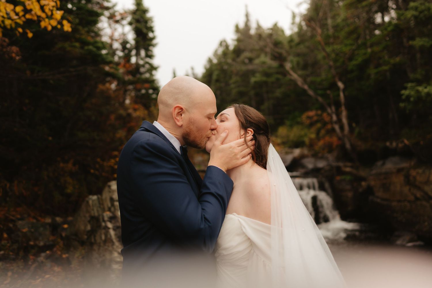 Romantic winter wedding couple shares intimate kisses against snowy forest backdrop in multiple candid moments.