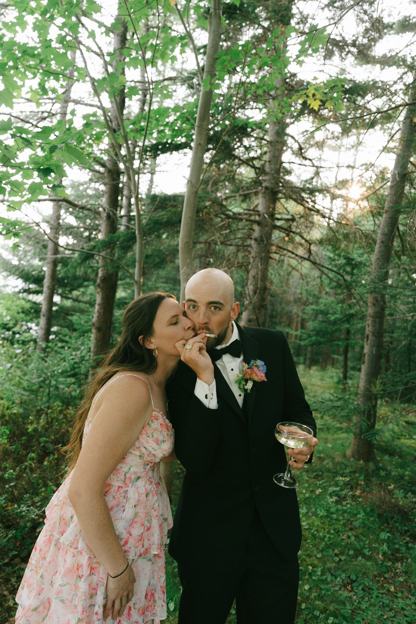 Romantic outdoor wedding photography sequence in a lush green forest setting.