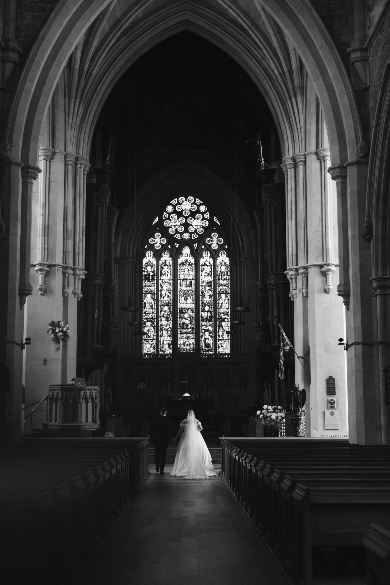 Dramatic black and white views of a church interior with beautiful arched architecture.