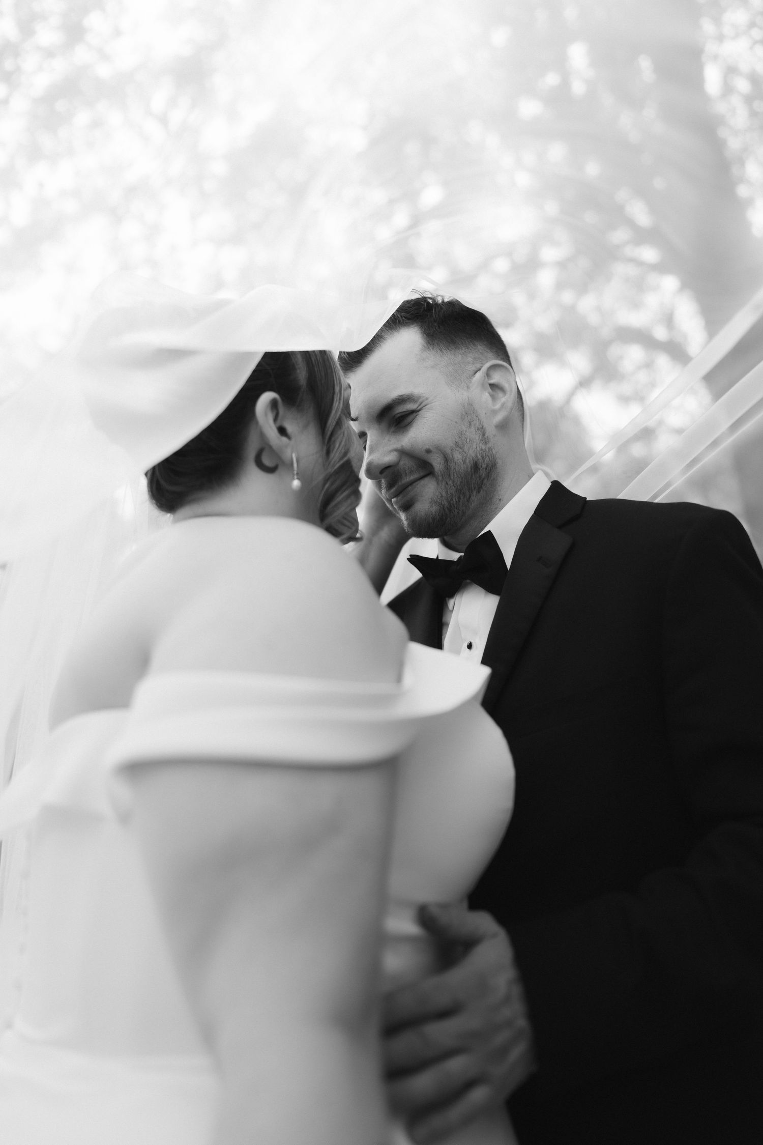 Black and white candid sequence of romantic wedding moments with dreamy bokeh background.