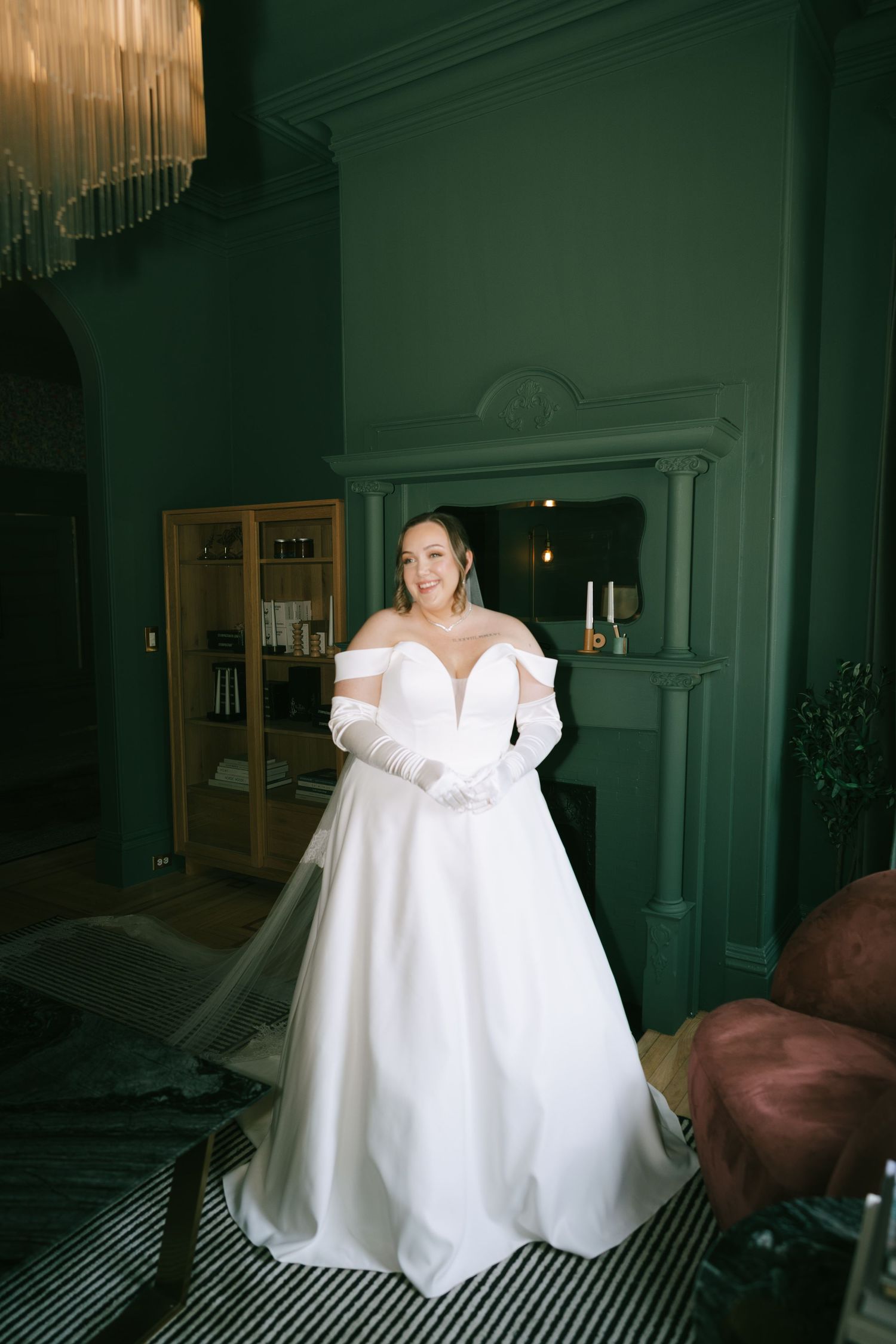 A wedding dress captures movement and light in an atmospheric vintage interior.