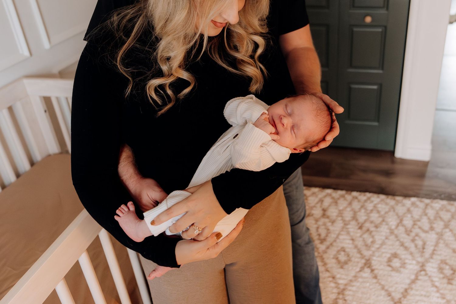 An intimate moment showing gentle care and bonding with a newborn baby.