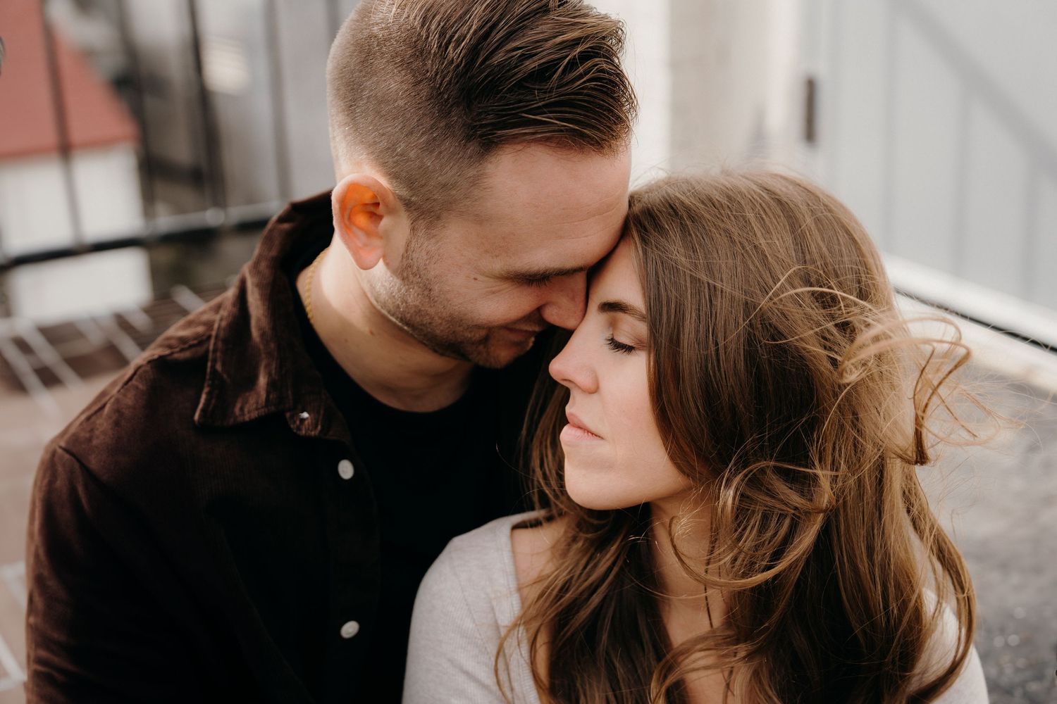 Close-up shots of tender moments between couple in natural light.