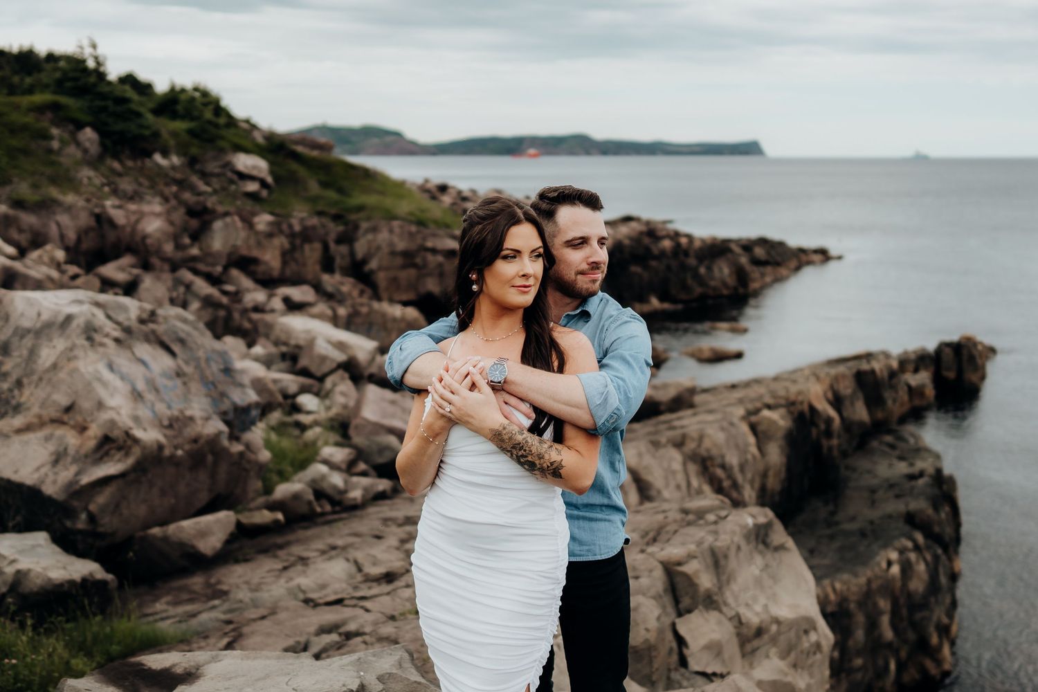 Romantic coastal engagement session on rugged ocean cliffs.