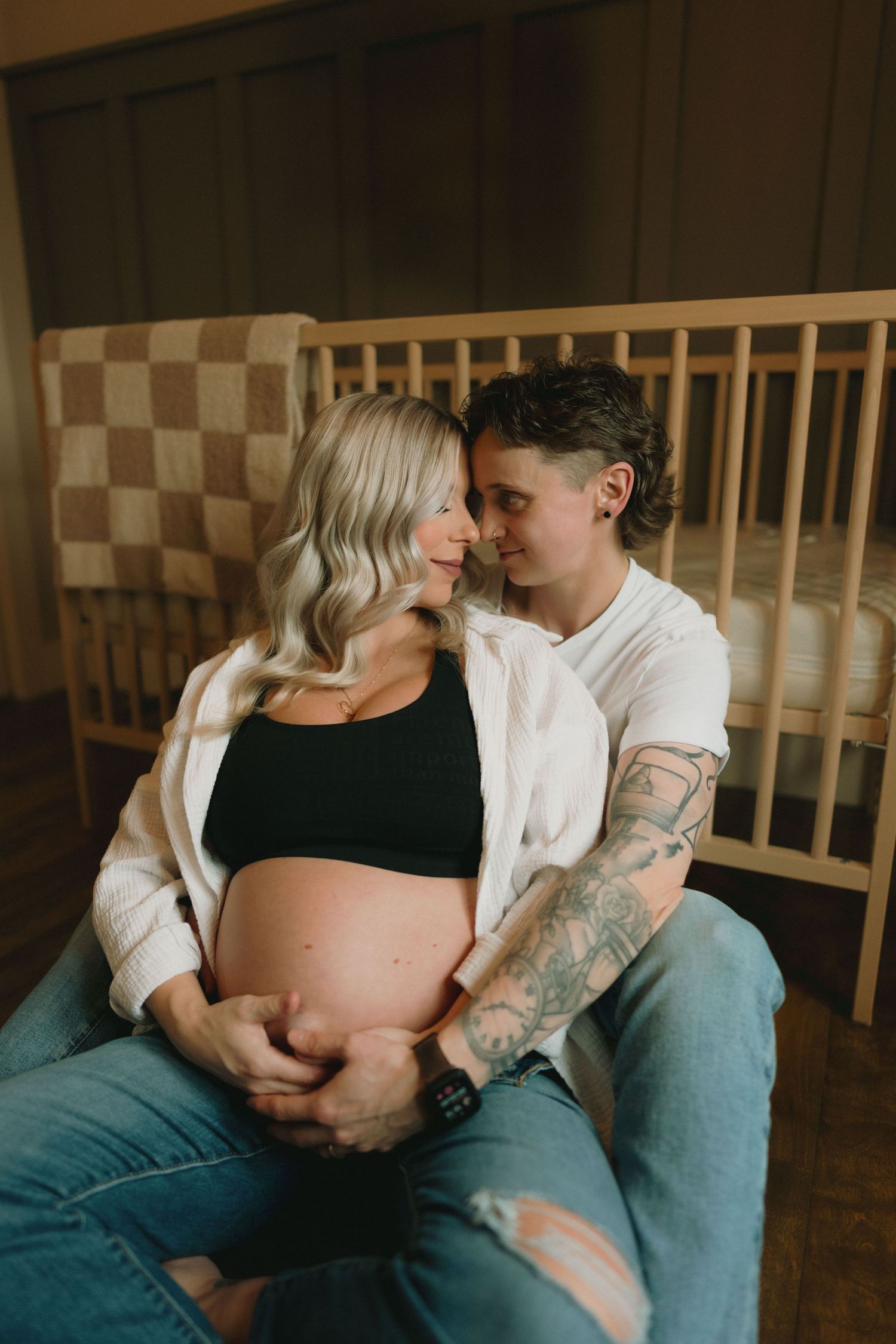 Intimate maternity photo series showing couple embracing and connecting during pregnancy photoshoot.