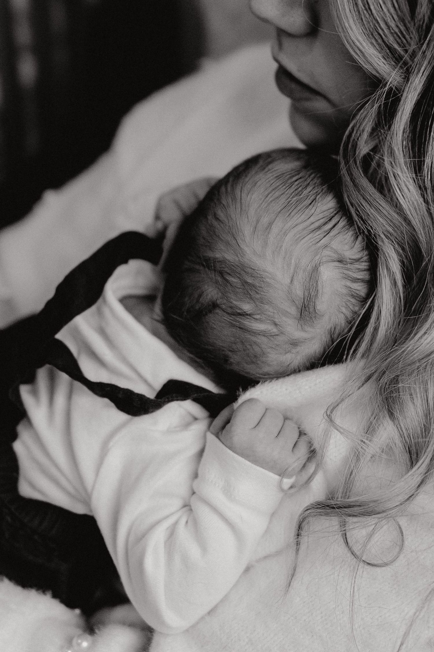 Tender black and white photography series showing intimate moments and gentle touches.