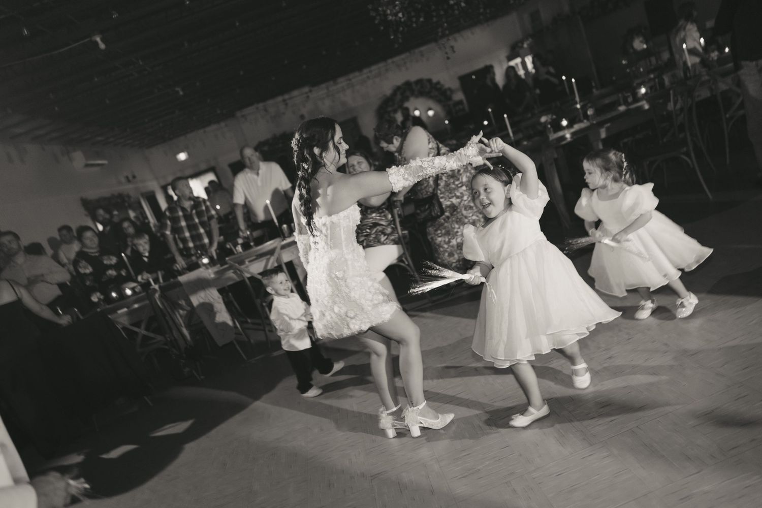 Black and white dance performance photos show couples spinning and twirling on a ballroom dance floor.