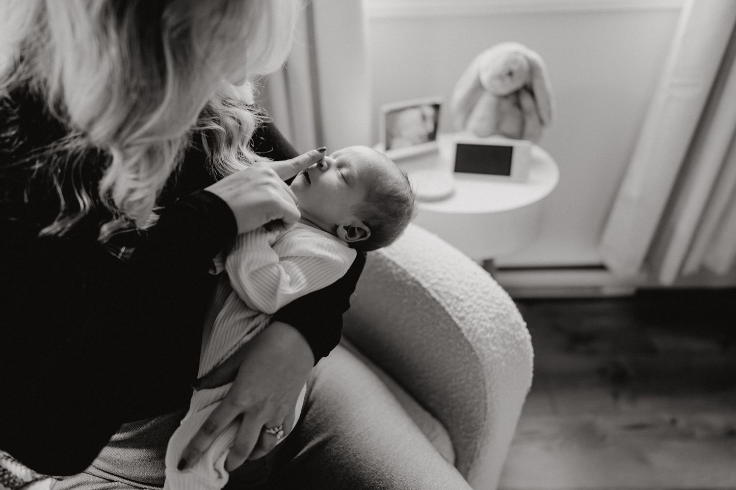 Intimate black and white photograph of a tender nurturing moment.