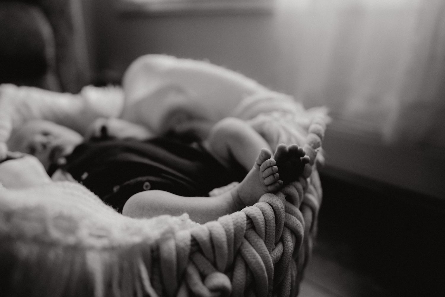 Intimate black and white photography capturing gentle moments between two people.