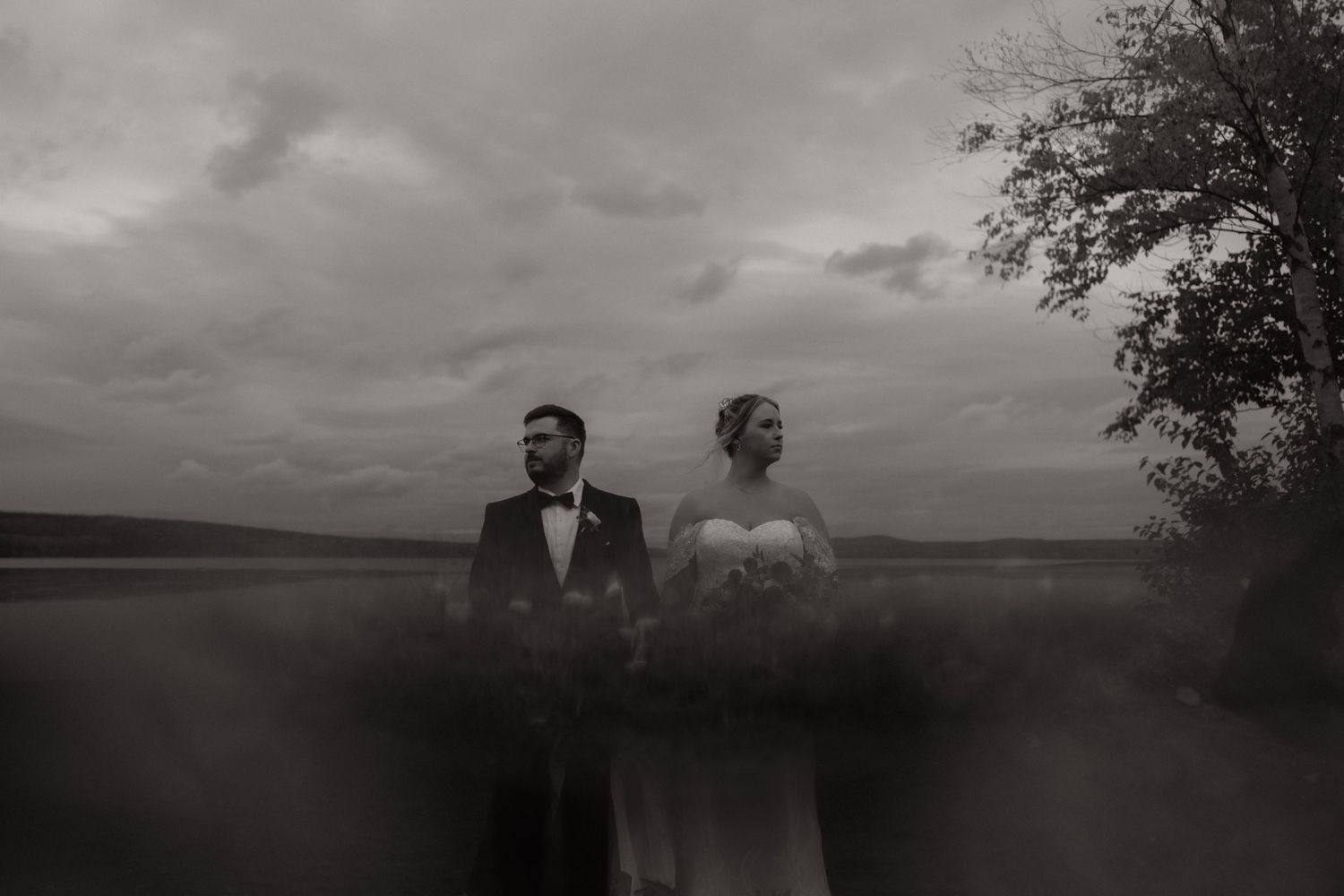 A romantic black and white wedding photo montage showing outdoor scenes and silhouettes against dramatic skies.
