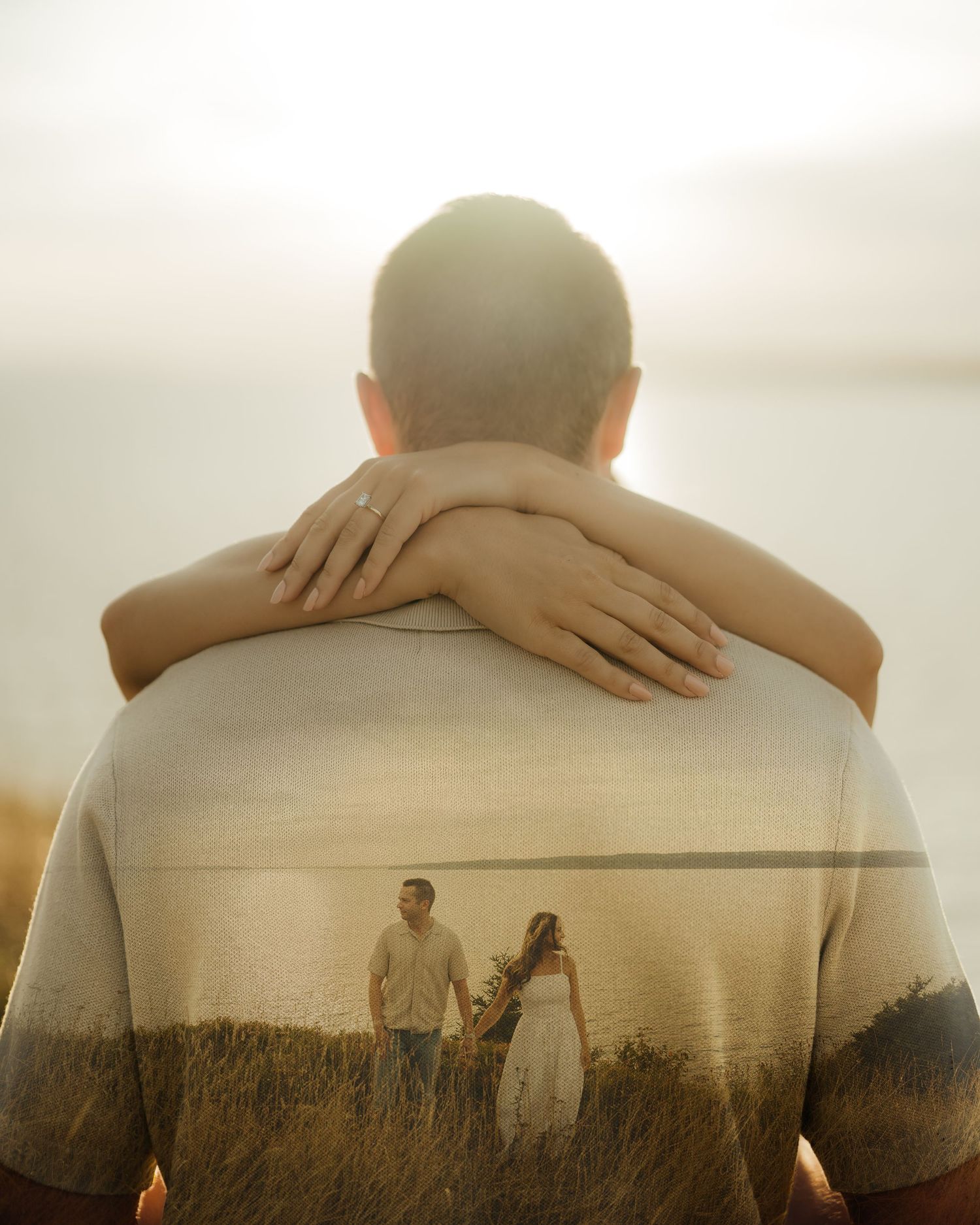 Double exposure portrait blending a person's silhouette with a scenic rural landscape at sunset.
