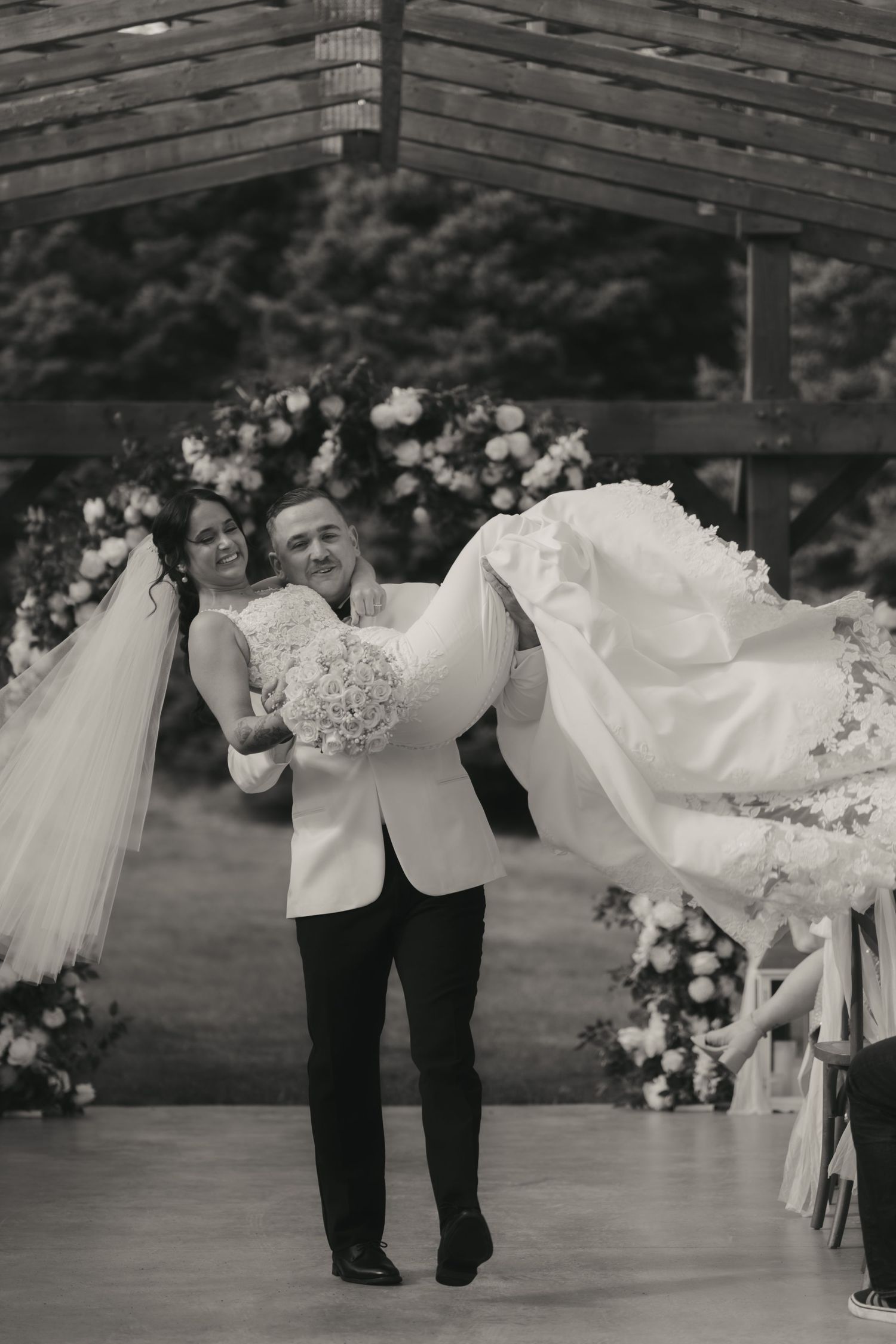 A playful wedding photo sequence showing a couple dancing and dipping in formal attire at an outdoor venue.