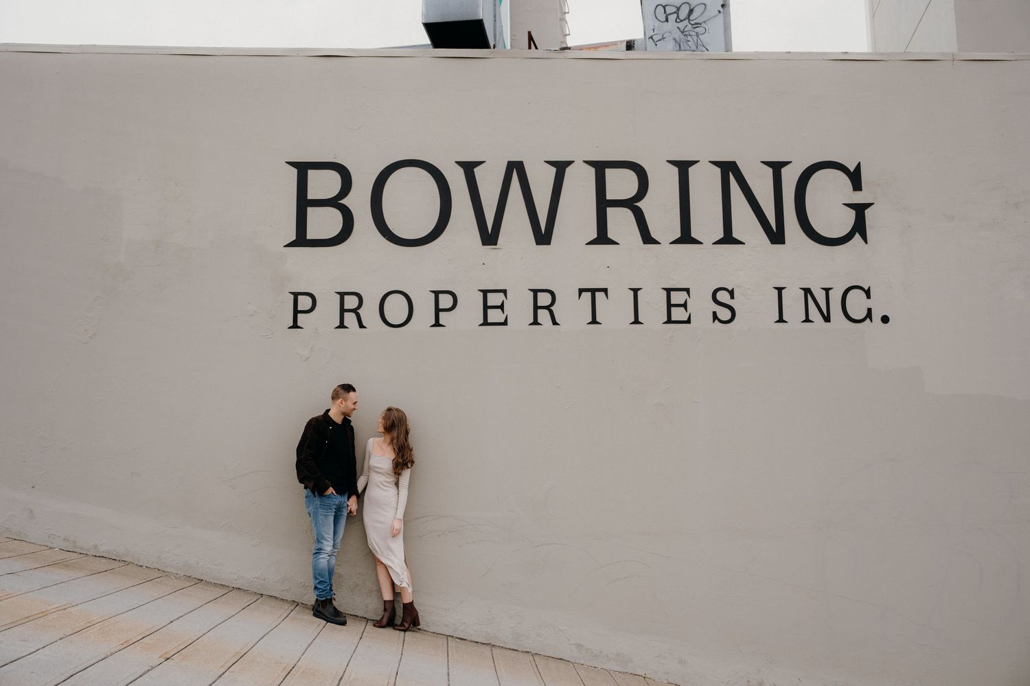 Professional wall lettering displaying Bowring Properties Inc branding in a commercial space.