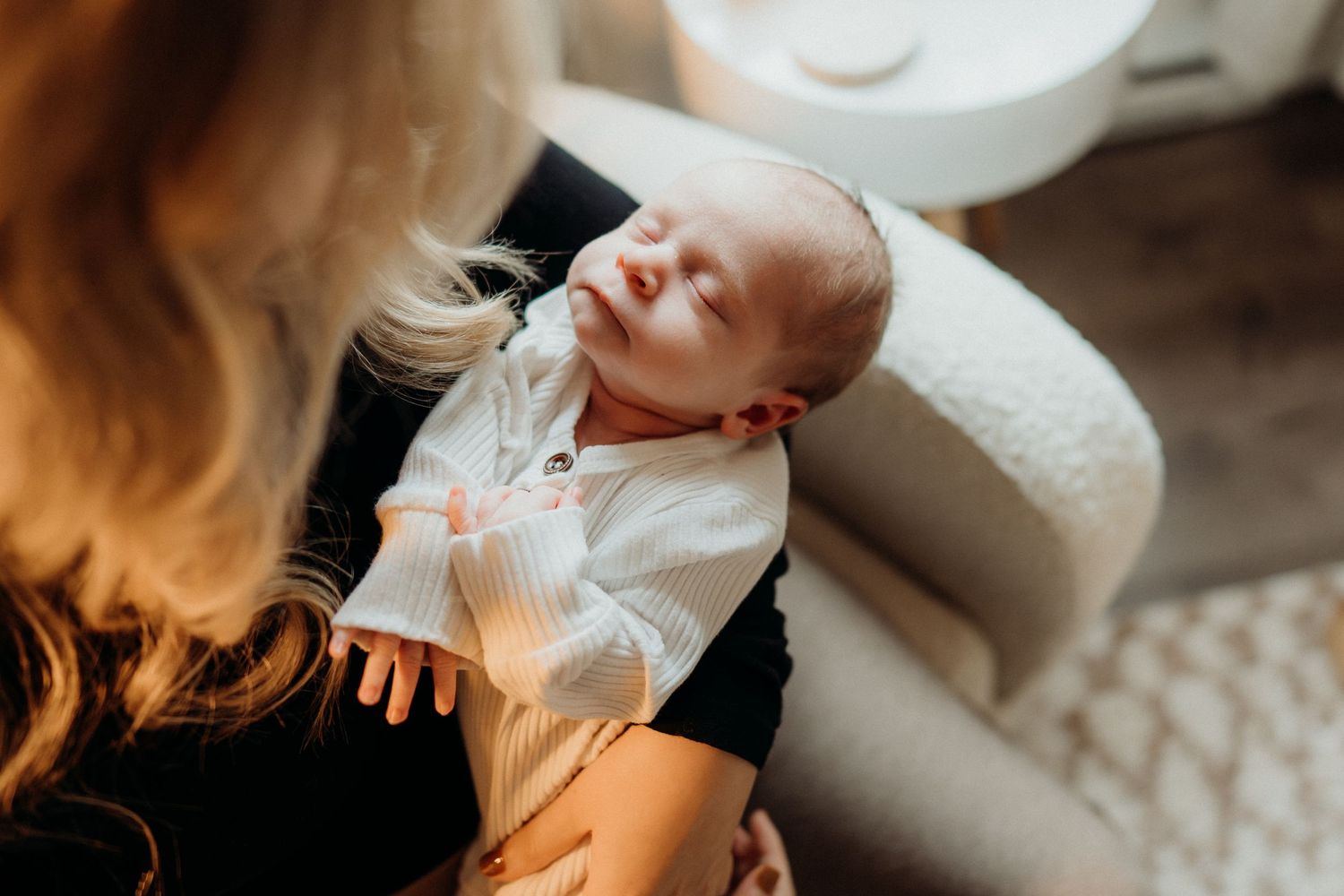 Gentle nurturing scene captured in warm natural light.