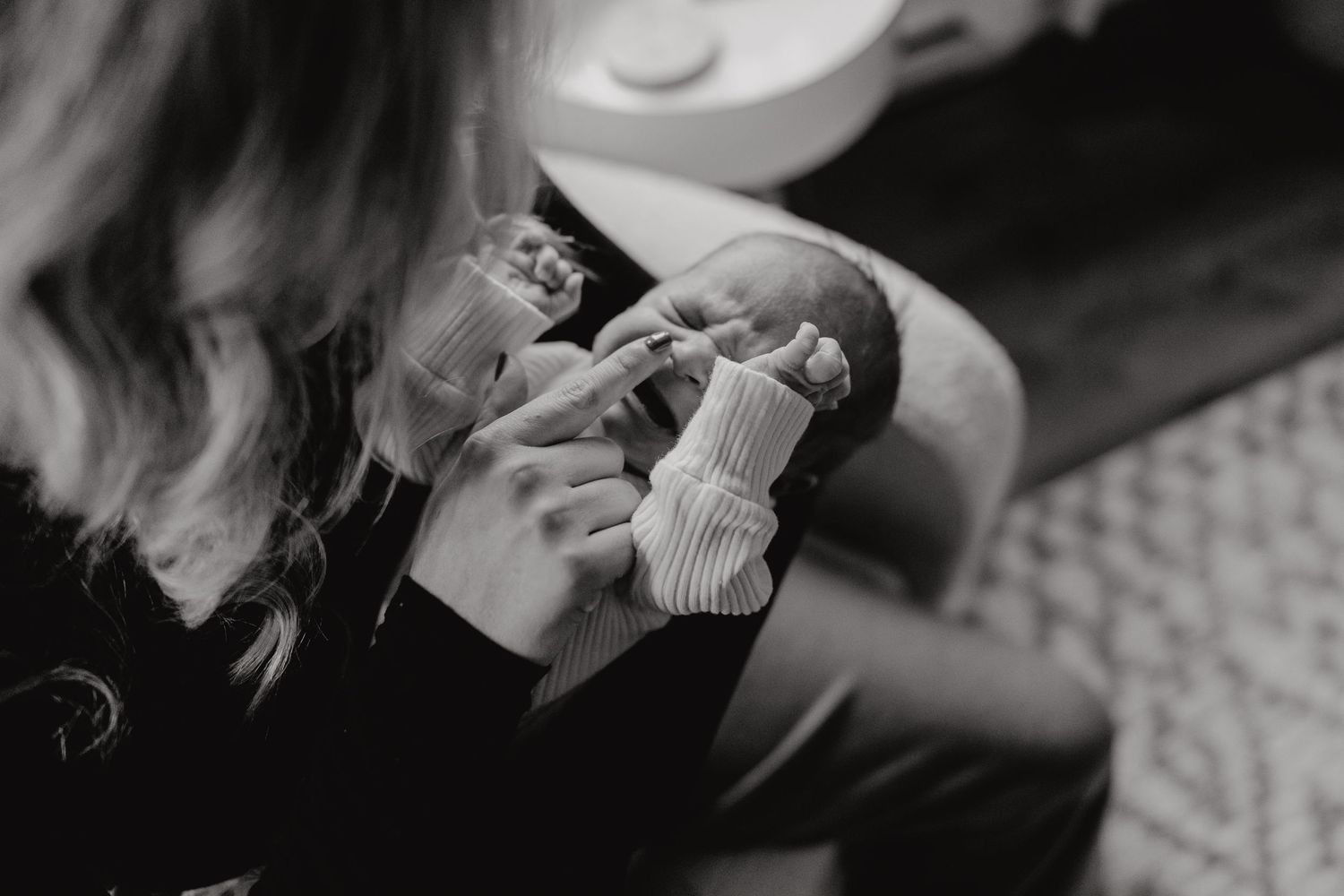 Black and white profile shot of tender nursery moment.