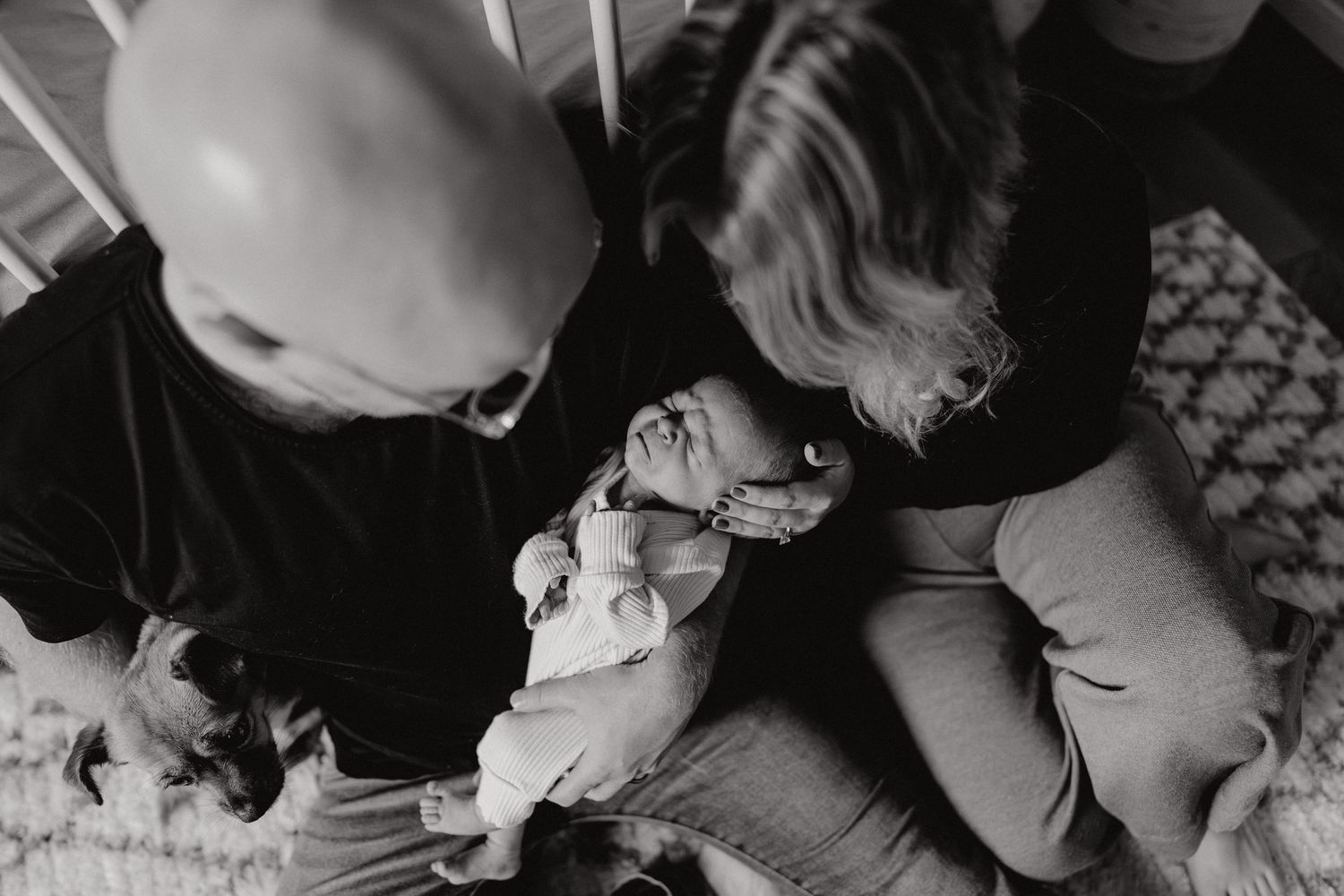 Close-up black and white shots of tender family moments.