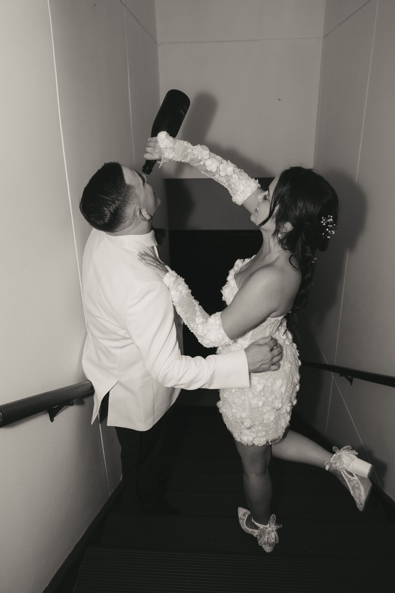 A series of black and white photos showing a couple dancing in a romantic sequence.