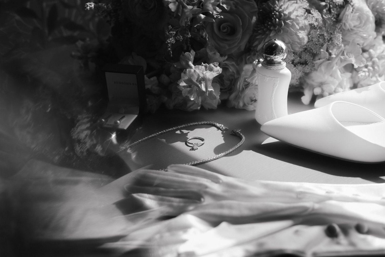 Black and white detail shots of wedding preparations and decorations.