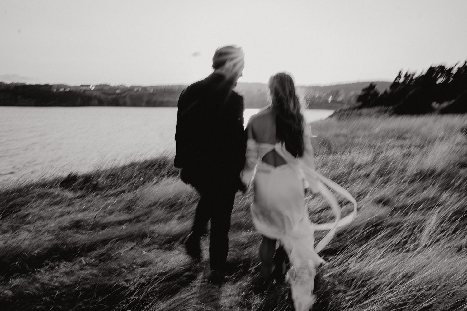 Dramatic coastal wedding photo series showing a couple in formal attire against a scenic backdrop.
