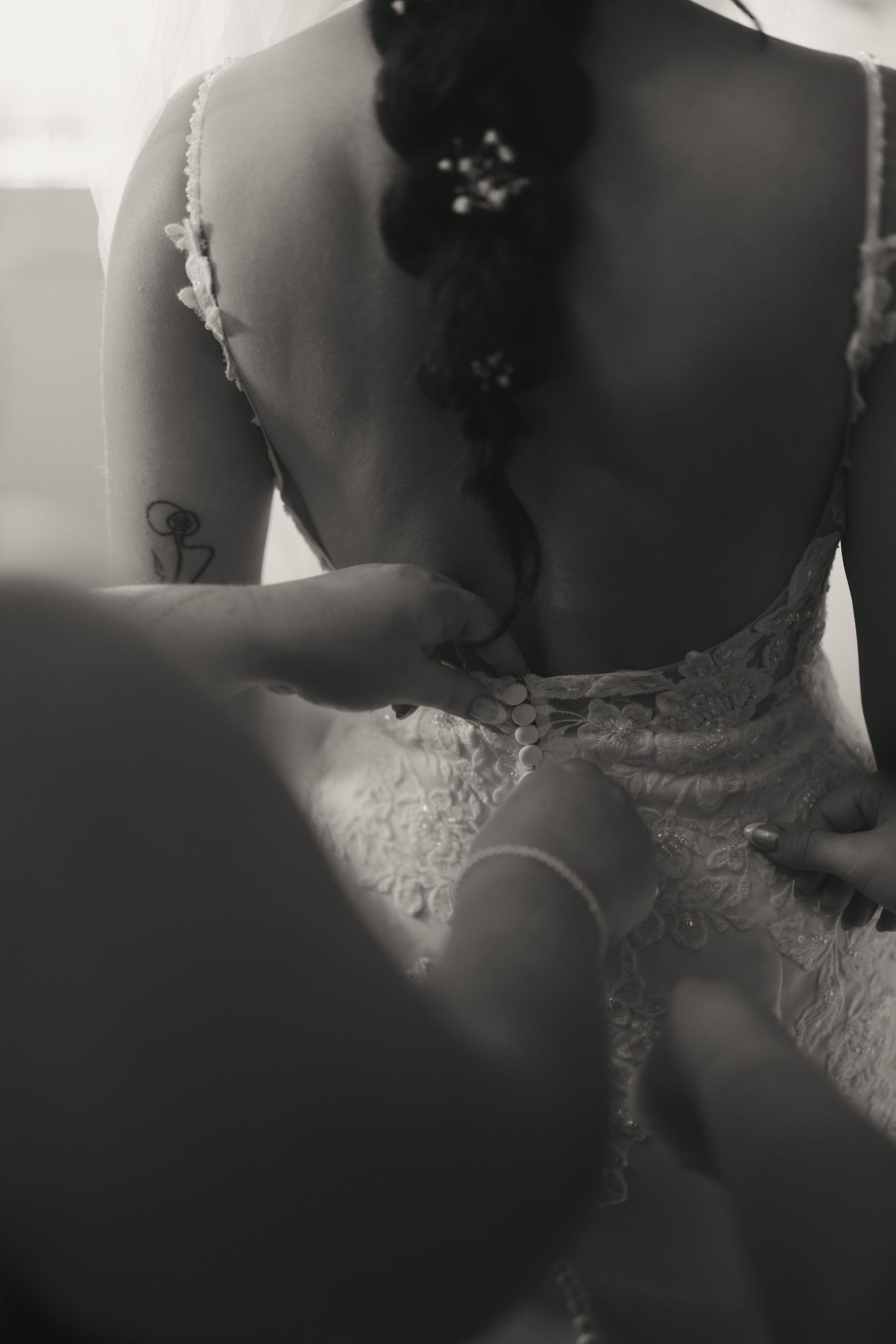 A romantic black and white photo series showing the silhouette of a couple in wedding attire.