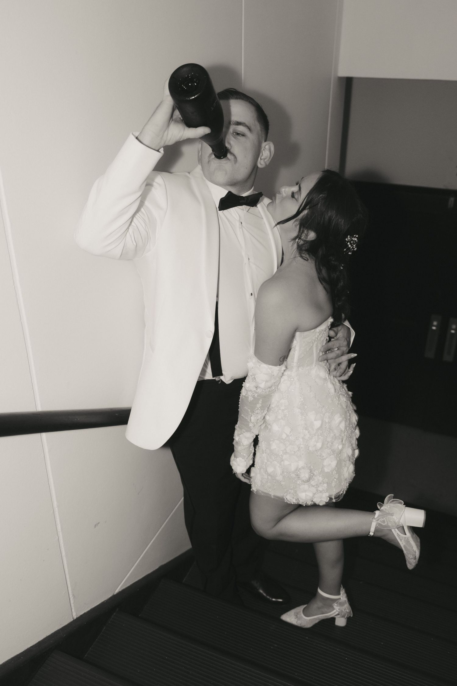 Black and white photo series showing intimate dance poses between two people in formal attire.