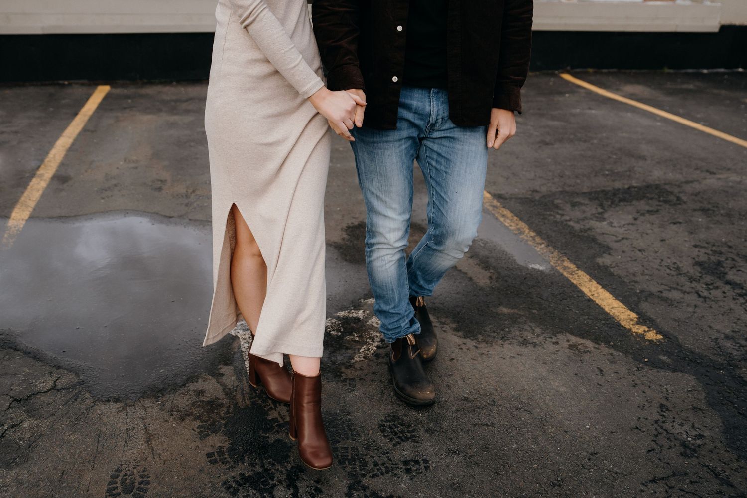 Artistic cropped photo focusing on couple's lower bodies during outdoor shoot.