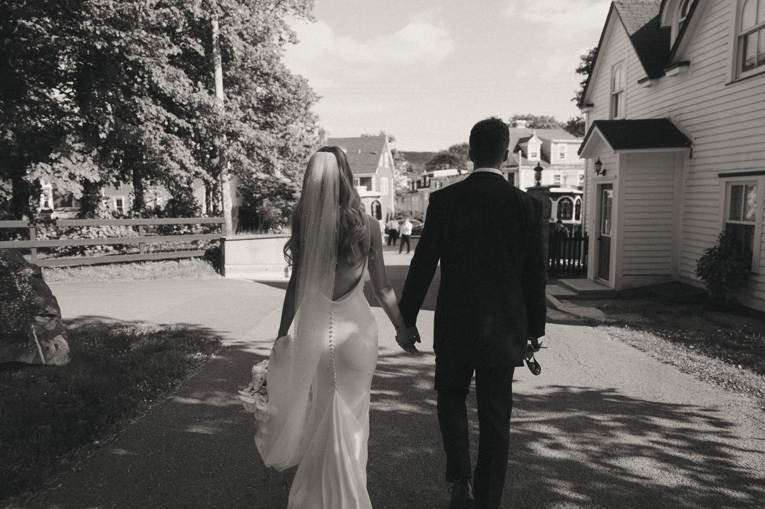 Black and white wedding photography in a small town residential setting.