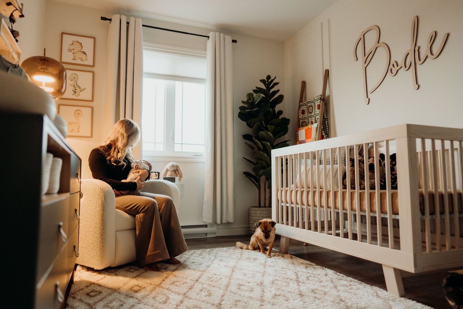 Contemporary nursery design with minimalist decor and geometric pattern carpet.