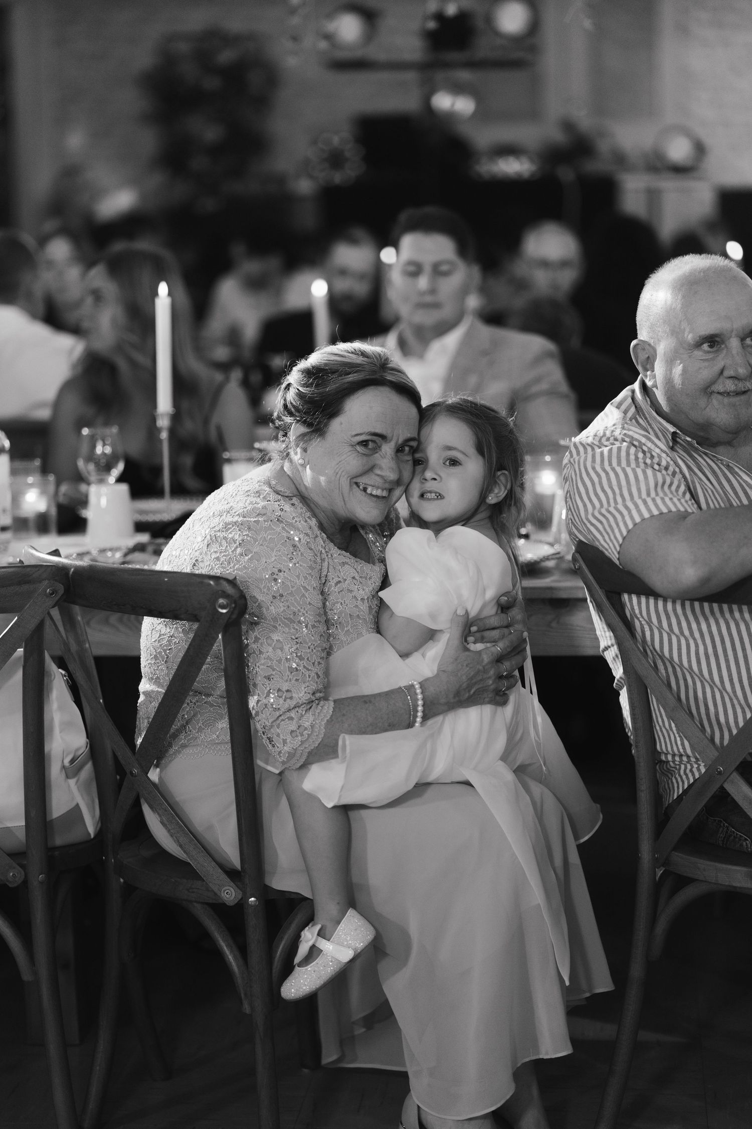 Black and white photo sequence showing a joyful dance between two people at a wedding reception.