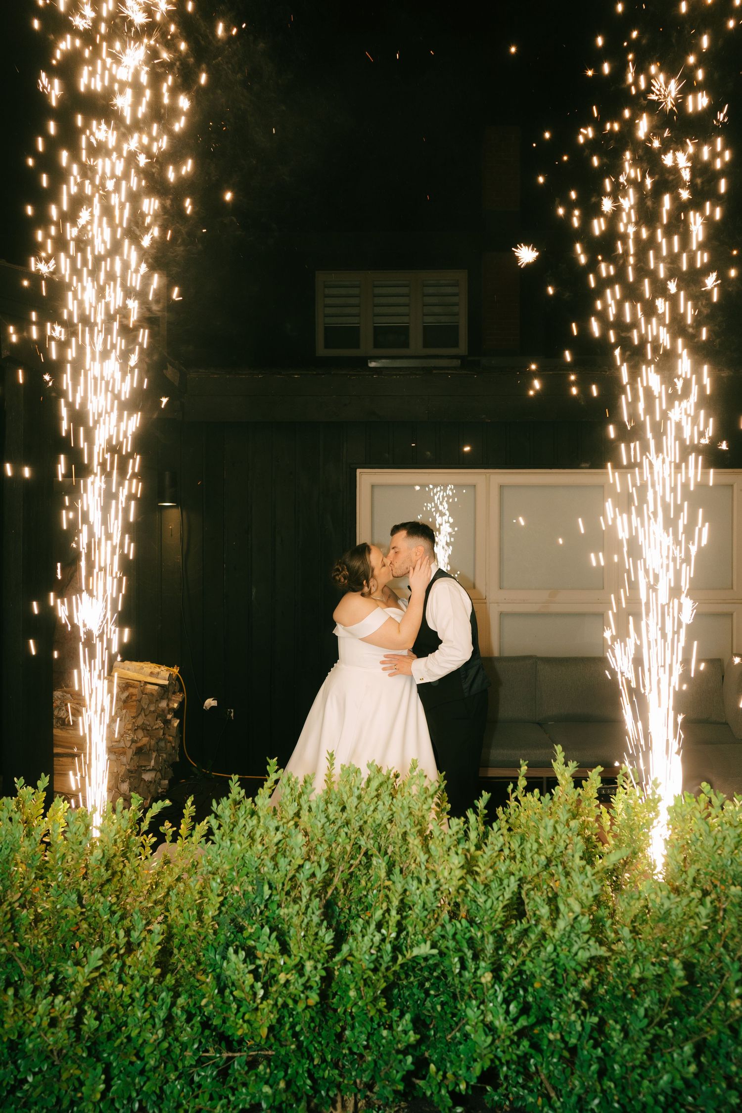 Fountain fireworks create spectacular backdrop for romantic wedding dance sequence.