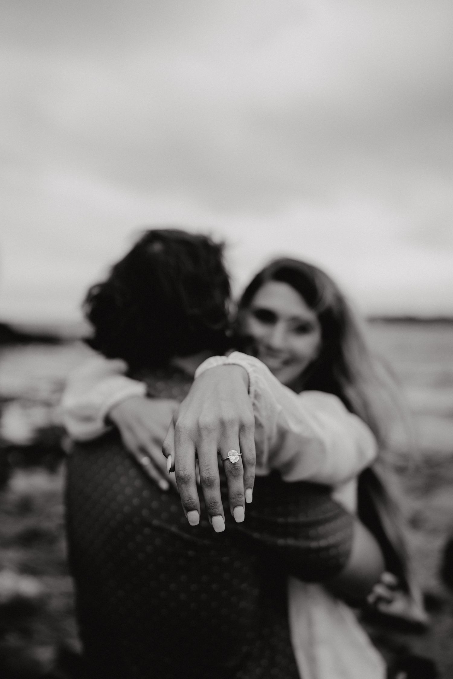 Black and white intimate photos highlighting ring and tender embraces.
