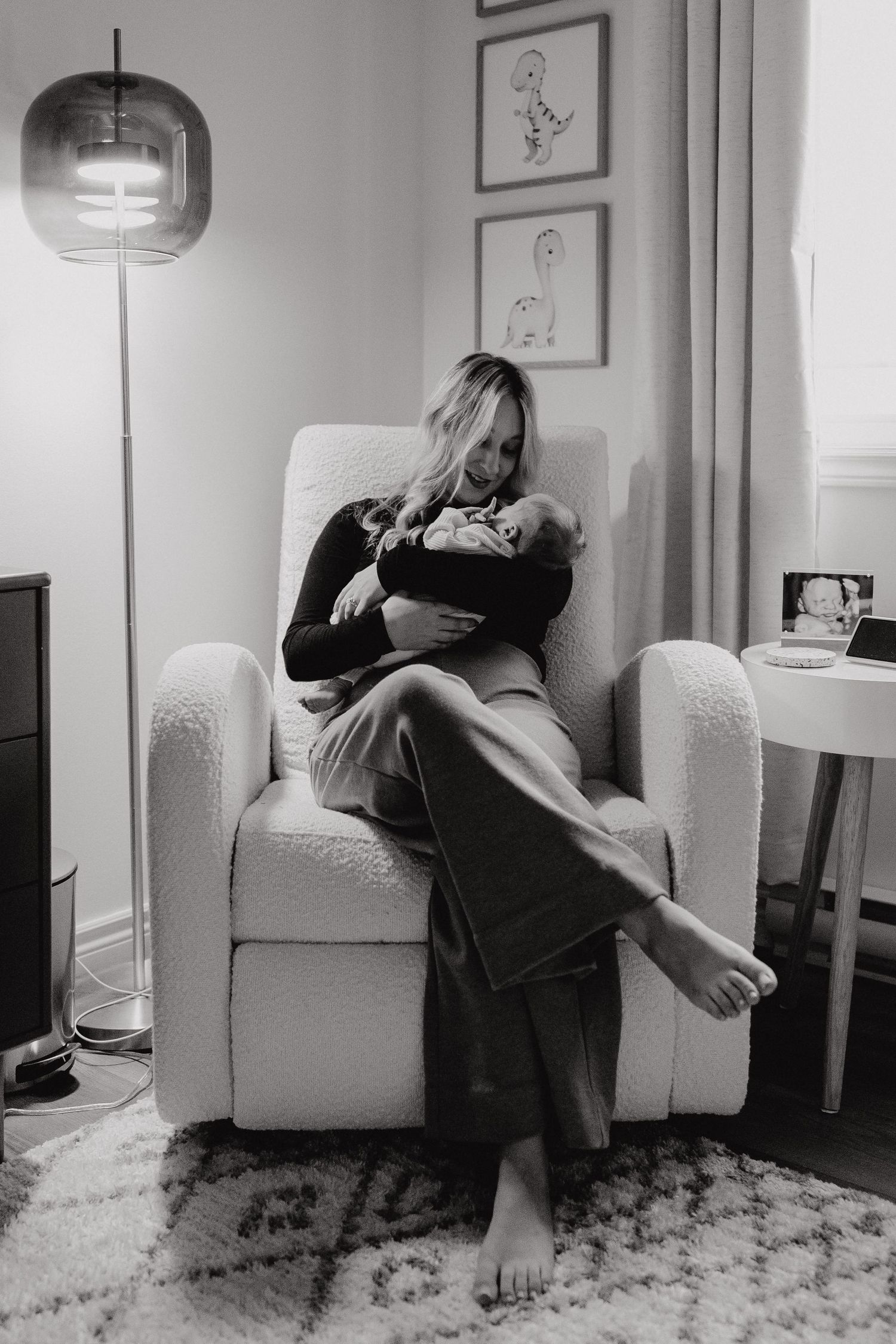 Intimate black and white photographs of quiet moments in a nursery setting.