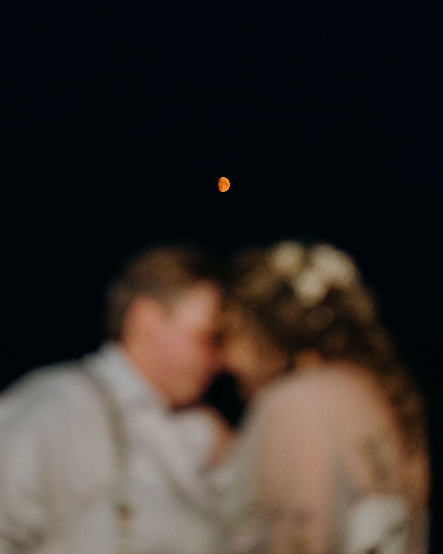 Artistic black and white photograph with intentional blur and dramatic lighting.