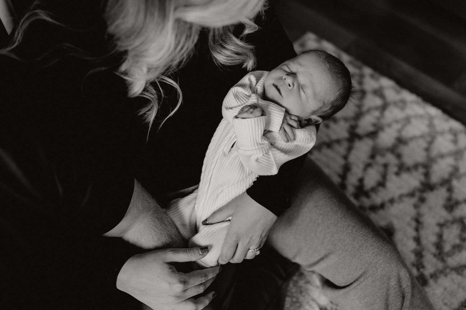Monochrome photo of tender moment in a nursery setting.