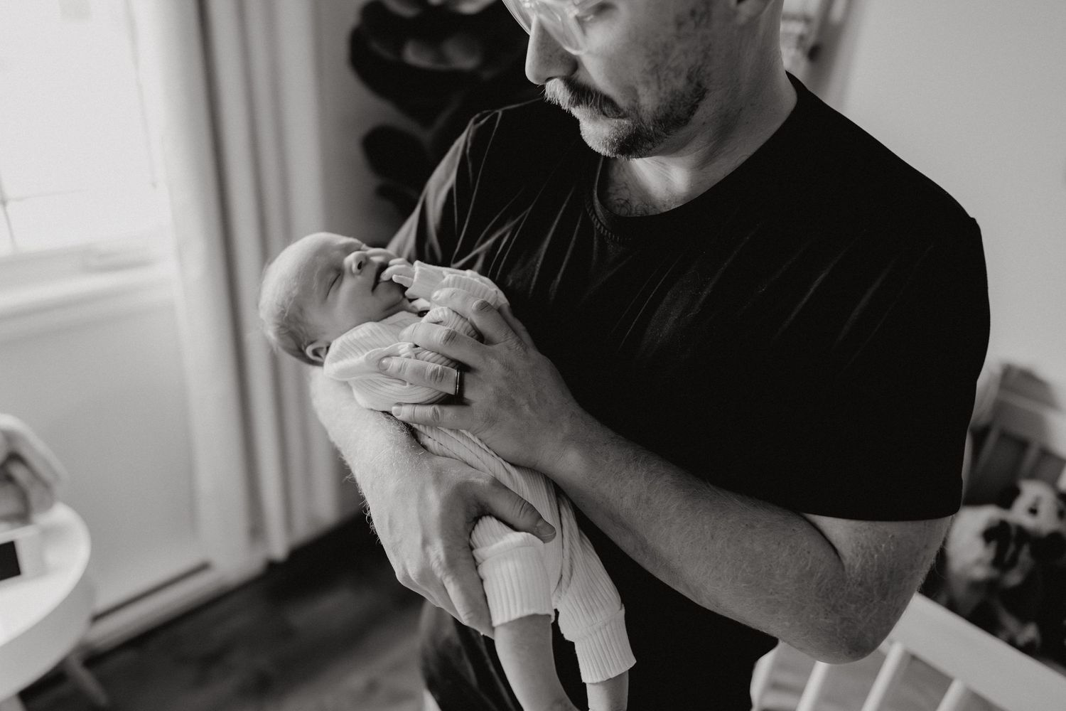 A series of tender black and white photographs showing gentle care moments.