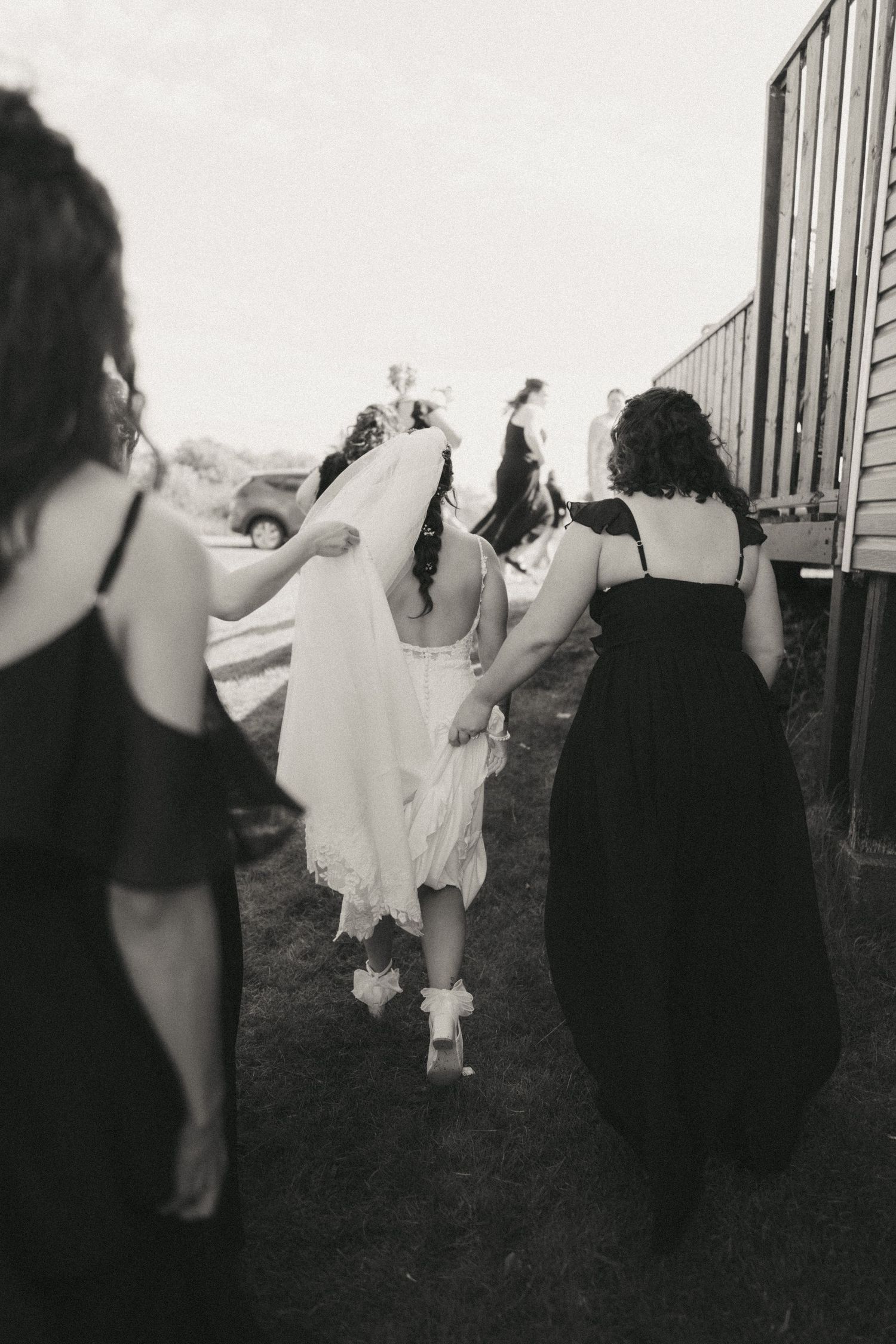 A sequence of black and white photos showing figures in motion against a dark background.