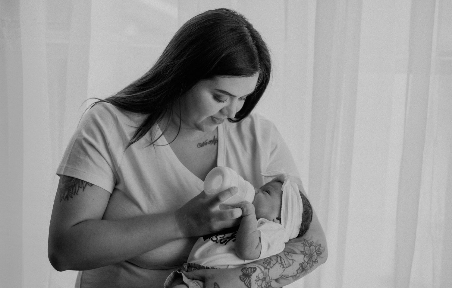 In-home newborn photography in Pittsburgh PA by Miranda Nicole Photo + Video, capturing tender moments in a cozy, natural environment.