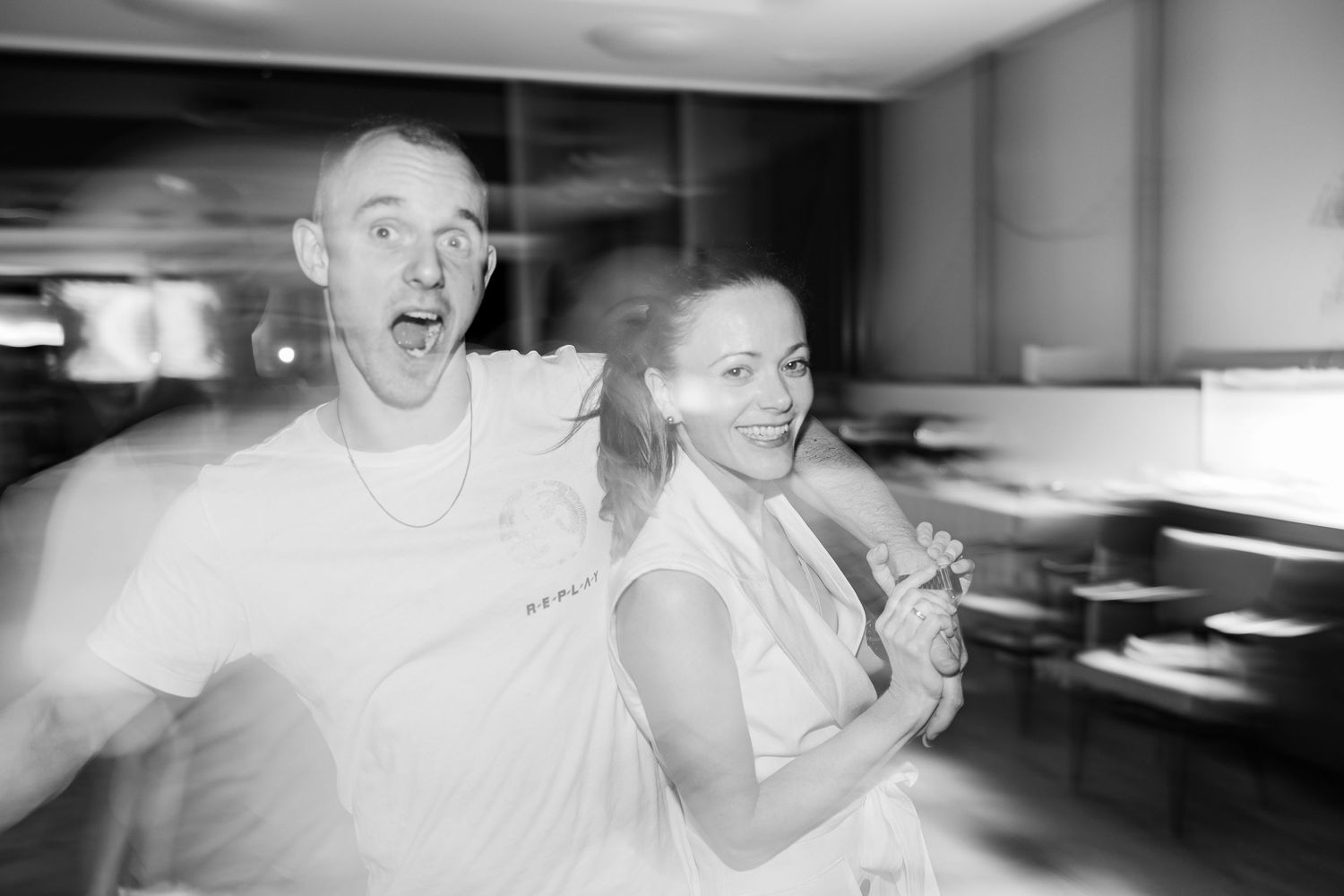 A black and white photo series showing five candid wedding reception moments of dancing and celebration - Hochzeitsfotograf Aargau