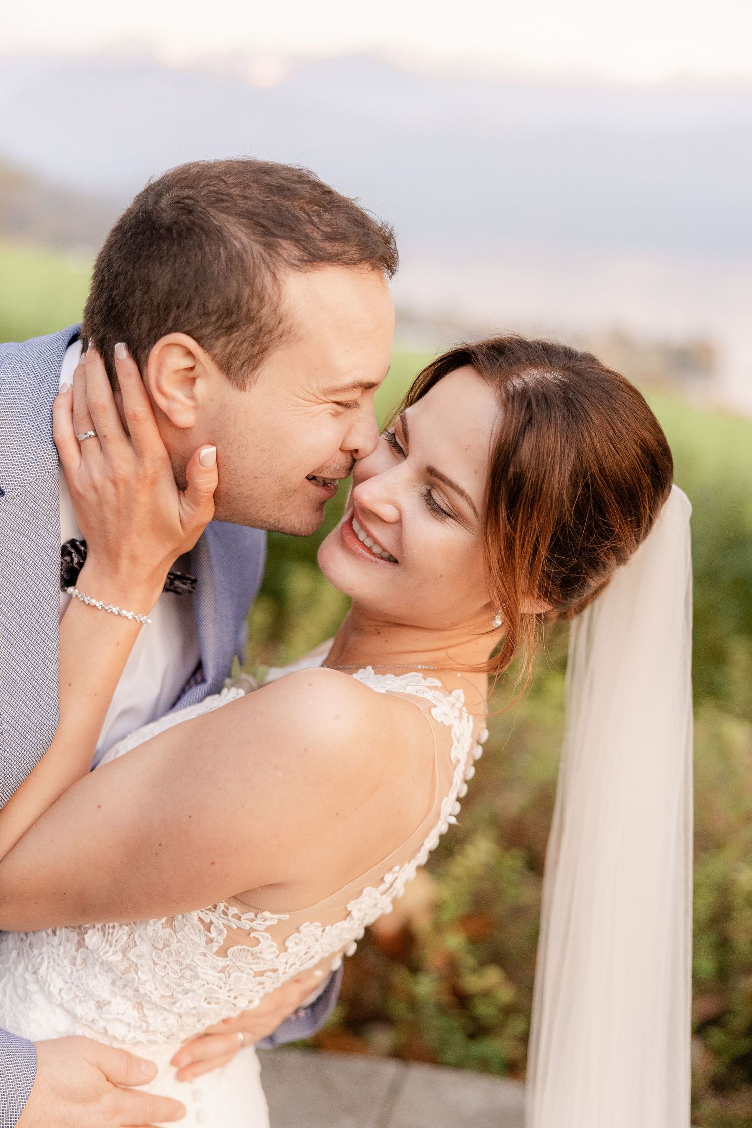 Romantic wedding couple shares intimate moments in a series of outdoor portrait photographs with soft lighting.