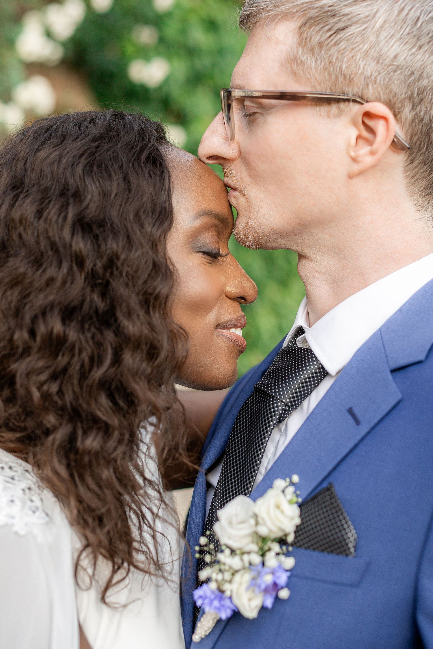 A romantic sequence of wedding photos showing a couple in blue suit and curly hair sharing intimate moments outdoors.