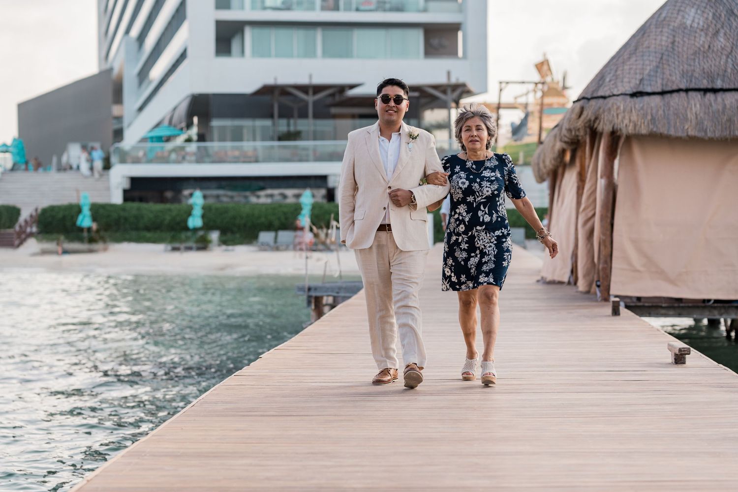 Dreams Vista Cancun Resort & Spa ceremony - groom walking with mom