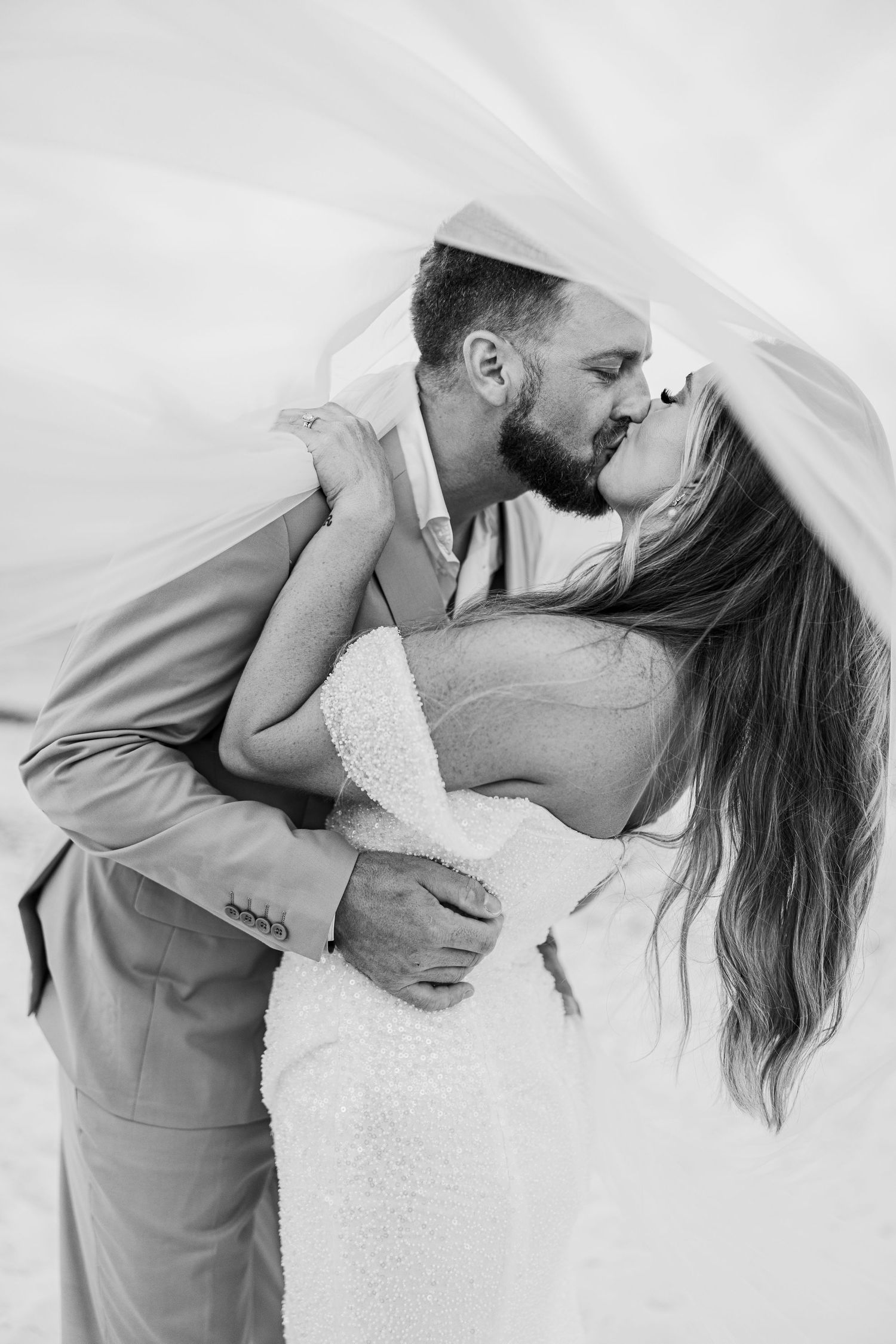 MEXICO WEDDING PHOTOGRAPHY & FILM  - bride and groom portrait kissing black and white